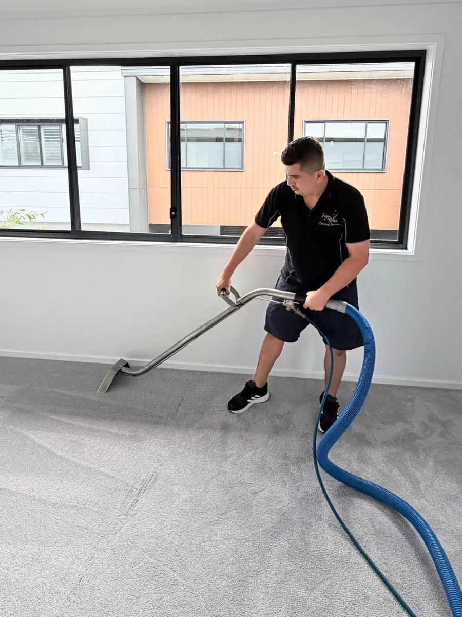 Carpet extraction machine in use on a residential carpet