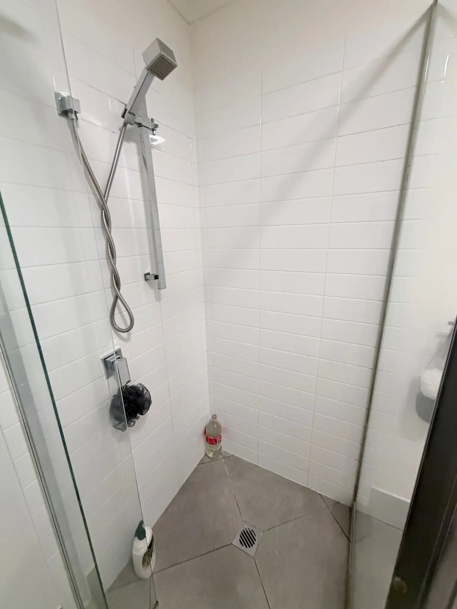 Shower grout and tiles after mould removal: clean and white